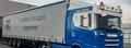 Blauwe Scania met tautliner van Mandema Transport Sappemeer